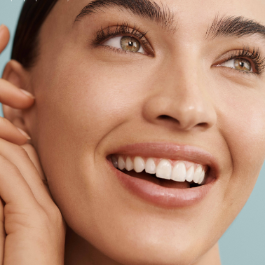 Close-up portrait of a woman with radiant skin